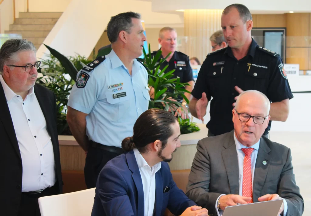 Local Disaster Management Group (LDMG) Chair and Sunshine Coast Council Mayor Mark Jamieson, is shown how the bushfire detection system works by exci's Julian Thaller.